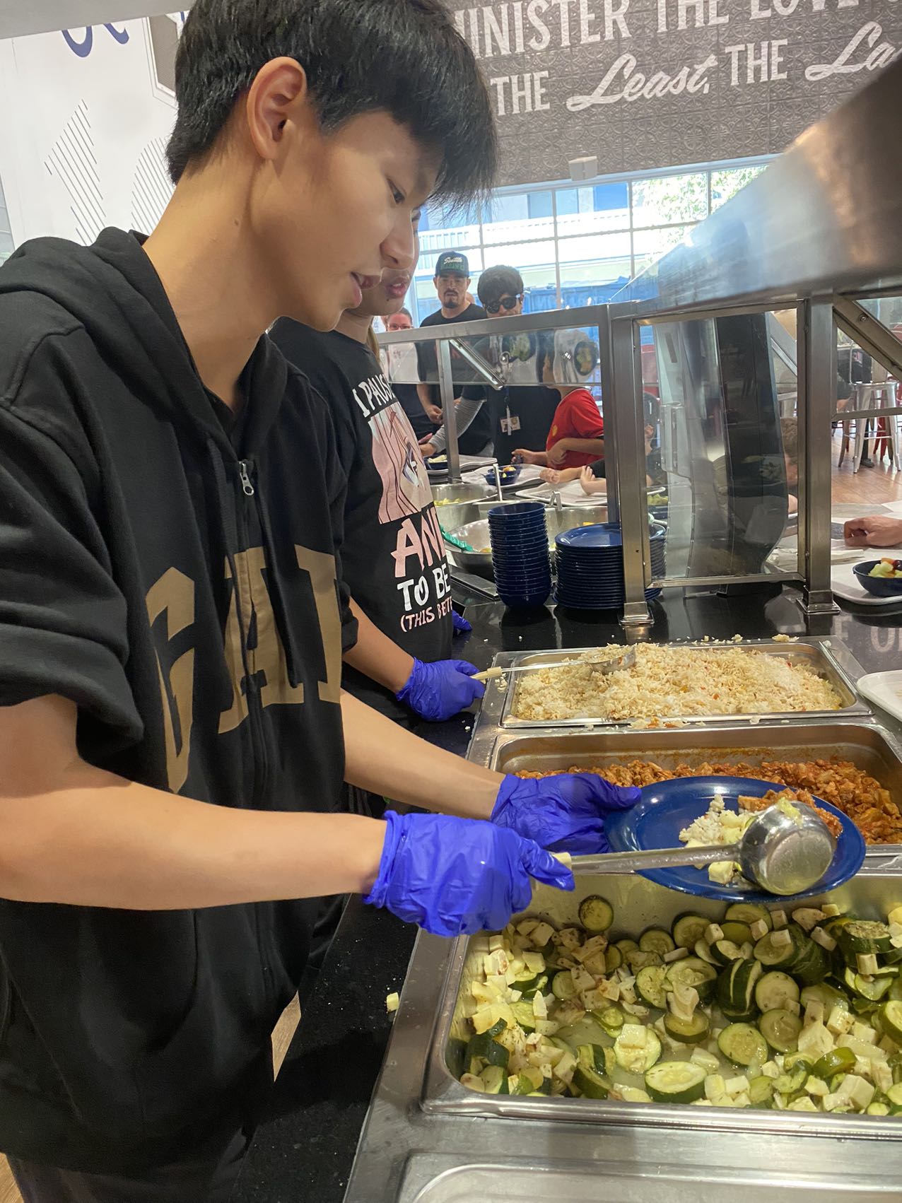 A volunteer serving a meal